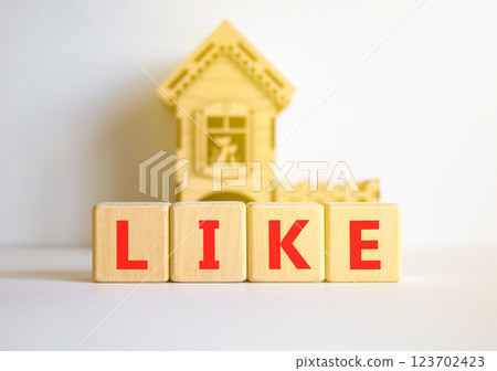 Like symbol. Concept word Like on beautiful wooden blocks. Beautiful white table white background. Wooden beautiful house. Business, lifestyle, support and like concept. Copy space. 123702423