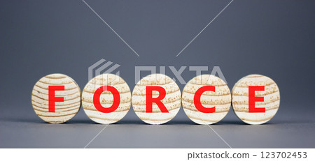 Force symbol. Concept word Force on beautiful wooden circles. Beautiful grey table grey background. Business lifestyle force concept. Copy space. Force symbol. Concept word Force on beautiful wooden circles. Beautiful grey table grey background. Business lifestyle force concept. Copy space. 123702453