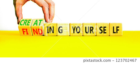 Finding or creating yourself symbol. Concept words Finding yourself or Creating yourself on beautiful wooden blocks. Beautiful white background. Business creating yourself concept. Copy space. 123702467