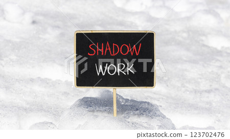 Shadow work psychology symbol. Concept words Shadow work on beautiful black chalk blackboard. Beautiful white snow background. Psychology shadow work concept. Copy space. 123702476