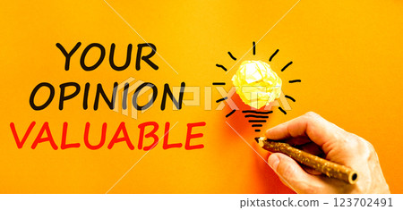 Your opinion valuable symbol. Concept words Your opinion valuable on orange paper. Beautiful orange background. Businessman hand. Light bulb icon. Business your opinion valuable concept. Copy space. Your opinion valuable symbol. Concept words Your opinion valuable on orange paper. Beautiful orange background. Businessman hand. Light bulb icon. Business your opinion valuable concept. Copy space. 123702491