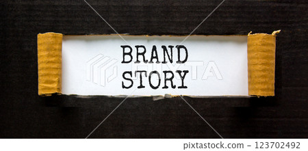 Brand story branding symbol. Concept words Brand story on beautiful white paper. Beautiful black paper background. Business brand story branding concept. Copy space. Brand story branding symbol. Concept words Brand story on beautiful white paper. Beautiful black paper background. Business brand story branding concept. Copy space. 123702492