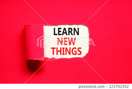 Learn new things symbol. Concept words Learn new things on beautiful white paper. Beautiful red table red background. Business motivational learn new things concept. Copy space. Learn new things symbol. Concept words Learn new things on beautiful white paper. Beautiful red table red background. Business motivational learn new things concept. Copy space. 123702502