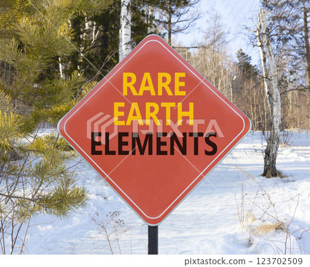 Rare earth elements symbol. Concept words Rare earth elements on beautiful red road sign. Beautiful winter forest background. Business and rare earth elements concept. Copy space. 123702509