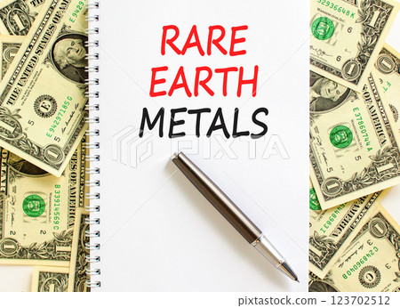 Rare earth metals symbol. Concept words Rare earth metals on beautiful white note. Dollar bills. Beautiful background from dollar bills. Business and rare earth metals concept. Copy space. 123702512