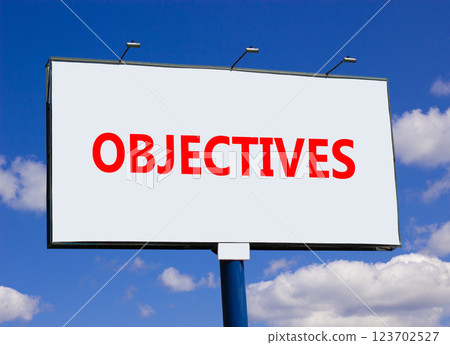 Objectives symbol. Concept word Objectives on beautiful big white road sign. Beautiful blue sky and clouds background. Business objectives concept. Copy space. Objectives symbol. Concept word Objectives on beautiful big white road sign. Beautiful blue sky and clouds background. Business objectives concept. Copy space. 123702527