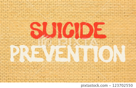 Suicide prevention symbol. Concept words Suicide prevention on beautiful brick wall. Beautiful brick wall background. Psychological and suicide prevention concept. Copy space. 123702550