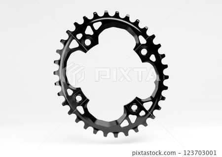 Black oval bicycle chainring against white isolated background, floating above the surface. Professional bicycle part. 123703001