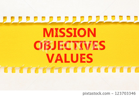 Mission objectives values symbol. Concept words Mission Objectives Values on beautiful yellow paper. Beautiful yellow white background. Business mission objectives values concept. Copy space. Mission objectives values symbol. Concept words Mission Objectives Values on beautiful yellow paper. Beautiful yellow white background. Business mission objectives values concept. Copy space. 123703346