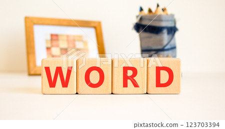 Word symbol. Concept word Word on beautiful wooden blocks. Beautiful picture frame and colored pencils. Beautiful white table white background. Business, lifestyle, support word concept. Copy space. 123703394
