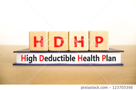 HDHP High Deductible Health Plan symbol. Concept word HDHP High Deductible Health Plan on beautiful blocks. Beautiful white background. Business HDHP High Deductible Health Plan concept. Copy space. HDHP High Deductible Health Plan symbol. Concept word HDHP High Deductible Health Plan on beautiful blocks. Beautiful white background. Business HDHP High Deductible Health Plan concept. Copy space. 123703398