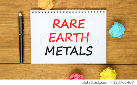 Rare earth metals symbol. Concept words Rare earth metals on beautiful white note. Black pen. Colored paper. Beautiful wooden background. Business and rare earth metals concept. Copy space. Rare earth metals symbol. Concept words Rare earth metals on beautiful white note. Black pen. Colored paper. Beautiful wooden background. Business and rare earth metals concept. Copy space. 123703467