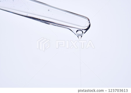 Pipette with delicate blue serum close-up. Pipette with delicate blue serum close-up. 123703613