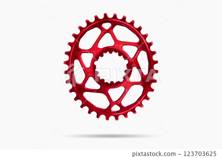 Red oval bicycle chainring against white isolated background, floating above the surface. Professional bicycle part. 123703625