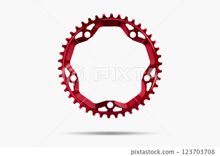 Red round bicycle chainring against white isolated background, floating above the surface. Professional bicycle part. 123703708