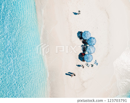 Aerial view of seascape atoll sandbank island with beach umbrellas in Maldives Aerial view of seascape atoll sandbank island with beach umbrellas in Maldives 123703791