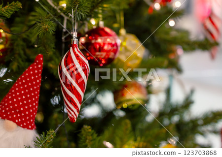 A Christmas tree with red and green ornaments and candy canes A Christmas tree with red and green ornaments and candy canes 123703868