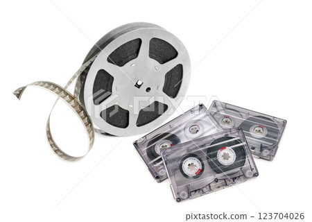 Film strips and audio cassettes isolated on white background. Film strips and audio cassettes isolated on white background. 123704026