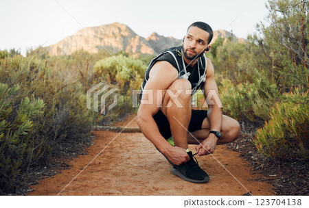 Fitness, nature and man tie shoes before start of marathon training, exercise or health workout in USA Hollywood Hills. Sports, dirt path and runner ready for peace, freedom or wellness cardio run Fitness, nature and man tie shoes before start of marathon training, exercise or health workout in USA Hollywood Hills. Sports, dirt path and runner ready for peace, freedom or wellness cardio run 123704138