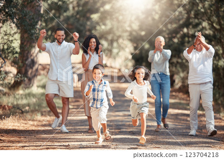 Nature, running and happy family cheering on children in a park having fun on summer holiday vacation in New York. Mother, father and grandparents supporting kids in a playful race for exercise 123704218