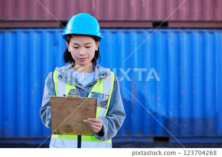 Woman in shipping, logistics and transport with checklist for freight inventory management or stock inspection. Storage container, cargo and commercial courier delivery for supply chain distribution 123704268