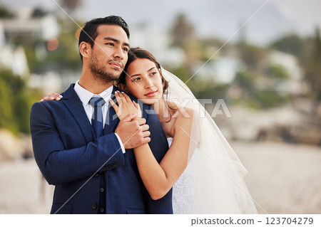 Wedding, love and couple hug by beach for commitment, care or bonding together. Thinking, travel and groom with bride for embrace with sea view at romantic, tropical and destination ceremony by ocean Wedding, love and couple hug by beach for commitment, care or bonding together. Thinking, travel and groom with bride for embrace with sea view at romantic, tropical and destination ceremony by ocean 123704279