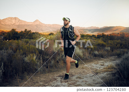 Fitness, training and exercise man running outdoor for a workout. Ambitious latino athlete run and exercising for a marathon. Male runner on nature trails jog to increase cardio health and wellness 123704280