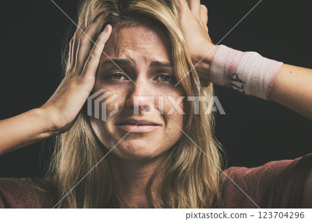 Suicide, depression and sad with a woman victim of violence in studio on a dark background. Anxiety, mental health and pain with a female thinking of death while suffering from pain, hurt or anger 123704296