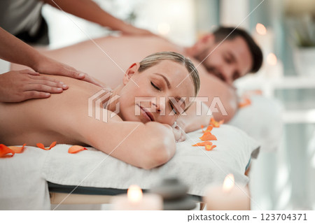 Love, relax and couple at a spa for a massage to celebrate marriage, anniversary or birthday on holiday. Man and woman sleeping with luxury care and wellness therapy for body on vacation at a hotel Love, relax and couple at a spa for a massage to celebrate marriage, anniversary or birthday on holiday. Man and woman sleeping with luxury care and wellness therapy for body on vacation at a hotel 123704371