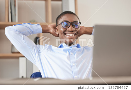 Black man, relax and laptop in office break, social media or web browsing after successful business deal. Leader, ceo or manager in Nigeria resting after writing email or planning finance strategy. Black man, relax and laptop in office break, social media or web browsing after successful business deal. Leader, ceo or manager in Nigeria resting after writing email or planning finance strategy. 123704457