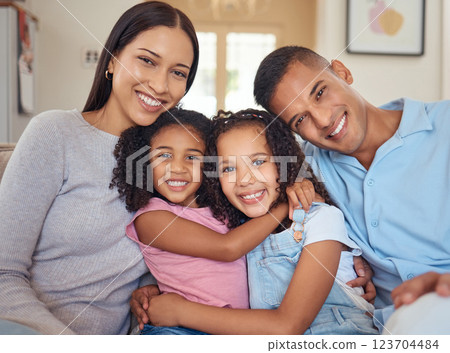 Portrait, happy family and living room sofa hug, smile and bonding for love, happiness and joy together at home. Parents of mother, father and girl children or kids on lounge couch smiling at house 123704484