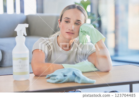 Woman, tired and burnout after cleaning house, office or home with spray, chemical or sanitizer. Cleaner, gloves and table for domestic work, job or service take time to rest, breathe and relax 123704485