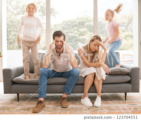 Stress parents, kids and jump on sofa in living room child problem for tired, sad and overworked mom and dad at home. Burnout, unhappy and sad mother and father on lounge couch with trouble children Stress parents, kids and jump on sofa in living room child problem for tired, sad and overworked mom and dad at home. Burnout, unhappy and sad mother and father on lounge couch with trouble children 123704551