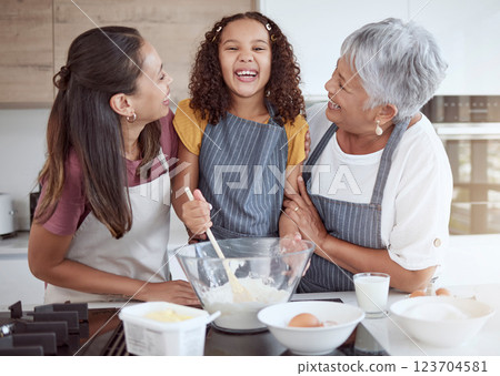 Happy family, cooking and learning with smiling girl bonding with her mother and grandmother in a kitchen. Love, teaching and baking by retired grandparent enjoying fun activity with child Happy family, cooking and learning with smiling girl bonding with her mother and grandmother in a kitchen. Love, teaching and baking by retired grandparent enjoying fun activity with child 123704581