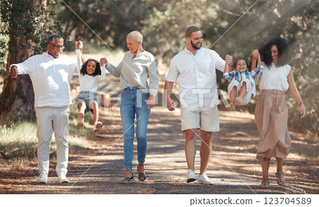 Big family walking in park holding hands for love, support and care on summer travel vacation in forest nature. Wellness, health and child development with grandparents and children or kids in woods 123704589