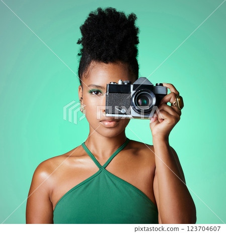 Black woman, photographer or fashion model on green studio background in creative art, clothes brand or designer social media blog. Portrait, camera and digital photography person with cool hairstyle Black woman, photographer or fashion model on green studio background in creative art, clothes brand or designer social media blog. Portrait, camera and digital photography person with cool hairstyle 123704607