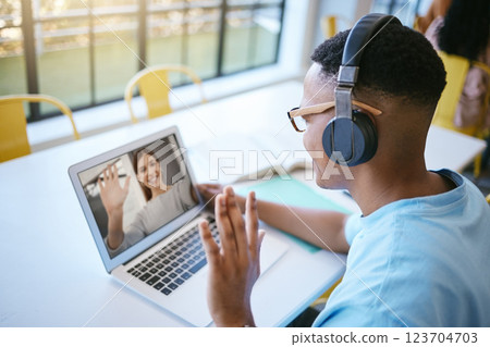 Video call, webinar and male student or employee waving for conference meeting on laptop, headphone and computer for communication. Remote black man on online zoom for education or chatting to friend Video call, webinar and male student or employee waving for conference meeting on laptop, headphone and computer for communication. Remote black man on online zoom for education or chatting to friend 123704703