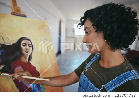 Painter, artist and woman at work on painting in studio for exhibition in museum, gallery or sale. Art, creative and girl with portrait in oil paint in workshop on canvas, brush and creativity 123704788