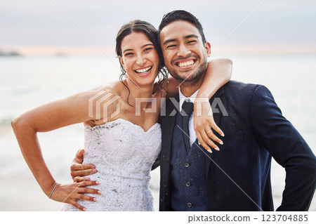 Wedding, happy and portrait of couple by beach for commitment, care or bonding together. Sea, travel and groom with bride for hug at romantic, tropical and destination marriage ceremony by ocean Wedding, happy and portrait of couple by beach for commitment, care or bonding together. Sea, travel and groom with bride for hug at romantic, tropical and destination marriage ceremony by ocean 123704885