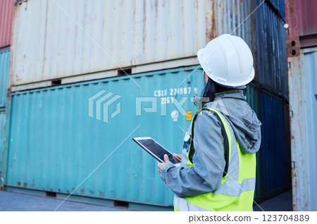 Warehouse, ecommerce and shipping with woman on digital tablet for stock and delivery logistics. Factory, supply chain and industrial management of container and cargo, checking online checklist app 123704889