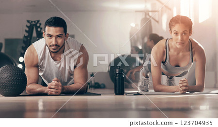 Exercise, plank and portrait of couple on floor of gym together for bonding, training or workout. Balance, fitness or power with man and woman athlete in health club for challenge or performance 123704935