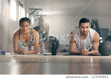 Fitness, plank and portrait of couple in gym together for bonding, training or workout. Balance, core or exercise with man and woman athlete in health club for challenge or performance routine Fitness, plank and portrait of couple in gym together for bonding, training or workout. Balance, core or exercise with man and woman athlete in health club for challenge or performance routine 123704951