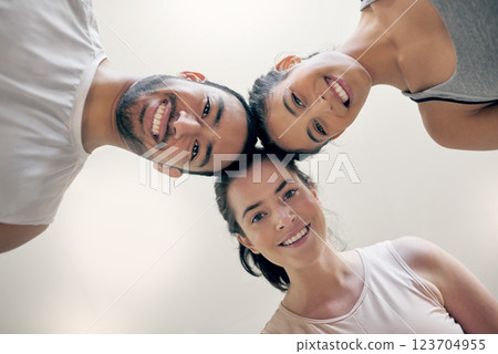 Portrait, fitness and people in gym, below and group of women with personal trainer or exercise. Wellness, happy and friends in class with instructor, circle and man in health club, huddle or workout Portrait, fitness and people in gym, below and group of women with personal trainer or exercise. Wellness, happy and friends in class with instructor, circle and man in health club, huddle or workout 123704955