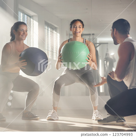 Personal trainer, balance and women with exercise ball, fitness and training for core strength in gym. Happy, instructor and workout for people in health club, wellness and equipment for muscles Personal trainer, balance and women with exercise ball, fitness and training for core strength in gym. Happy, instructor and workout for people in health club, wellness and equipment for muscles 123704993
