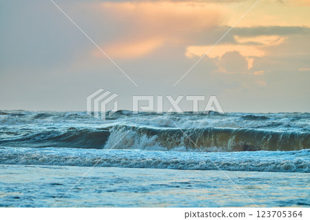 Sunset over north sea waves Sunset over north sea waves 123705364