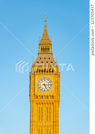 Big Ben is prominently displayed against a backdrop of a clear blue sky in London, showcasing its intricate architectural details and iconic clock face. Big Ben is prominently displayed against a backdrop of a clear blue sky in London, showcasing its intricate architectural details and iconic clock face. 123705457