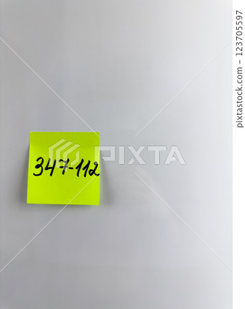 Reminder on refrigerator with the phone number of person Reminder on refrigerator with the phone number of person 123705597