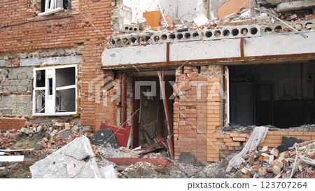View to destroyed residential buildings at Kharkivska oblast. Ruined houses after bomb attacks on ukrainian territory from russia army. Consequences of russian invasion of Ukraine. Slow motion 123707264