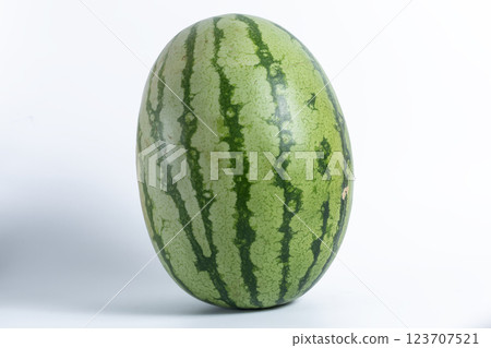 Close-up of a large green watermelon on a white background 123707521