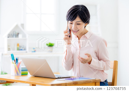 Young woman working remotely 123708735